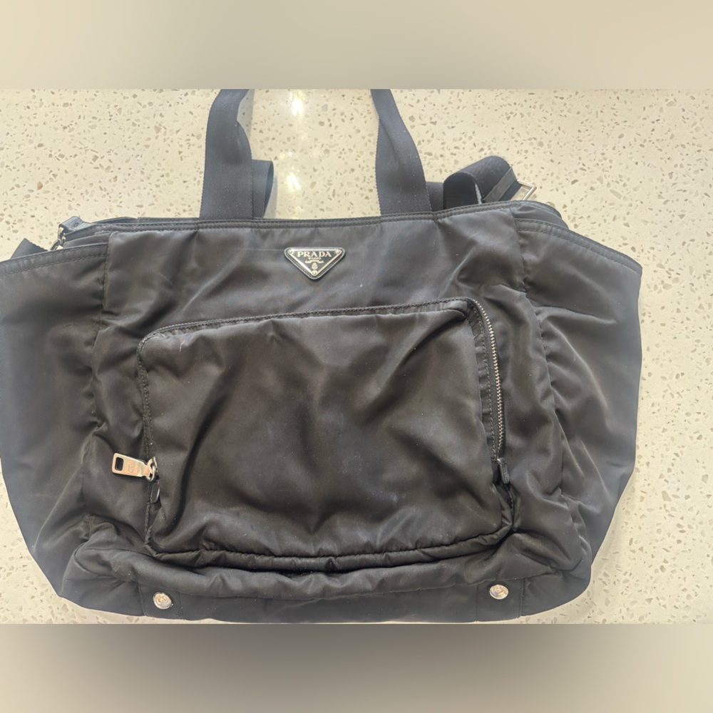 Prada Black Baby Bag with Structured Design and Silver Accents
